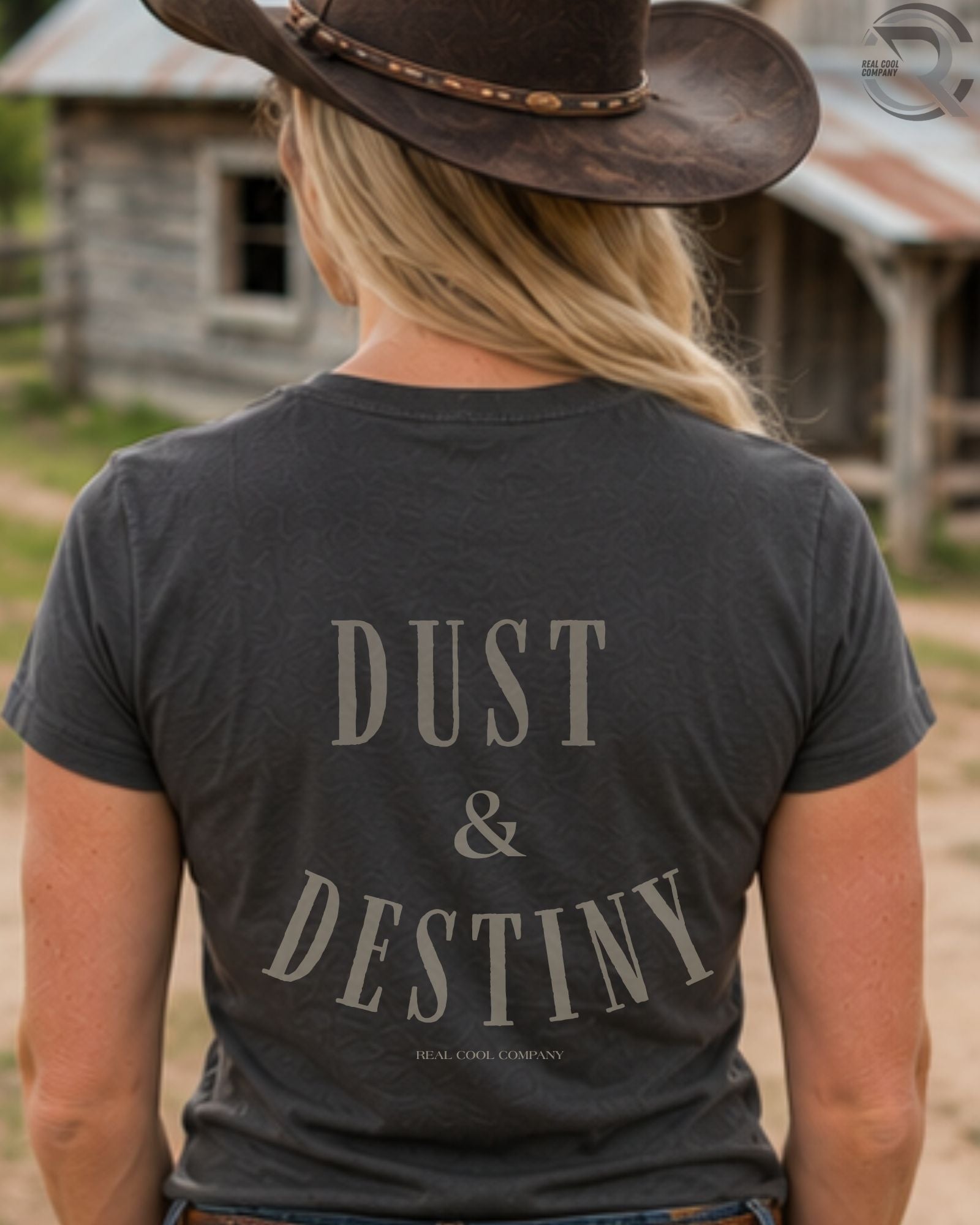 Cowgirl wearing Dust and Destiny western graphic tee in rustic country setting