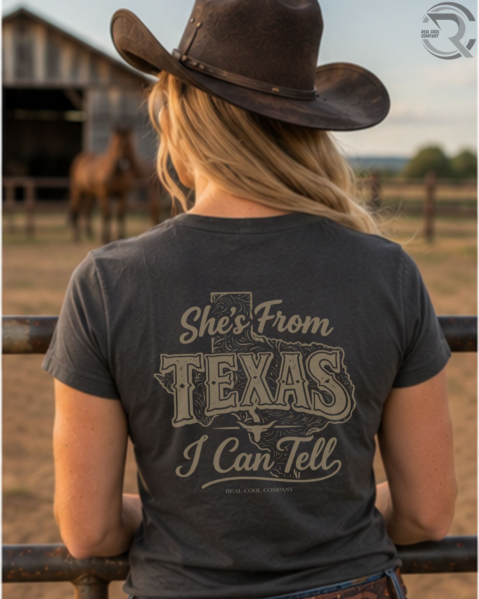 Cowgirl wearing She’s From Texas western graphic tee on ranch at sunset